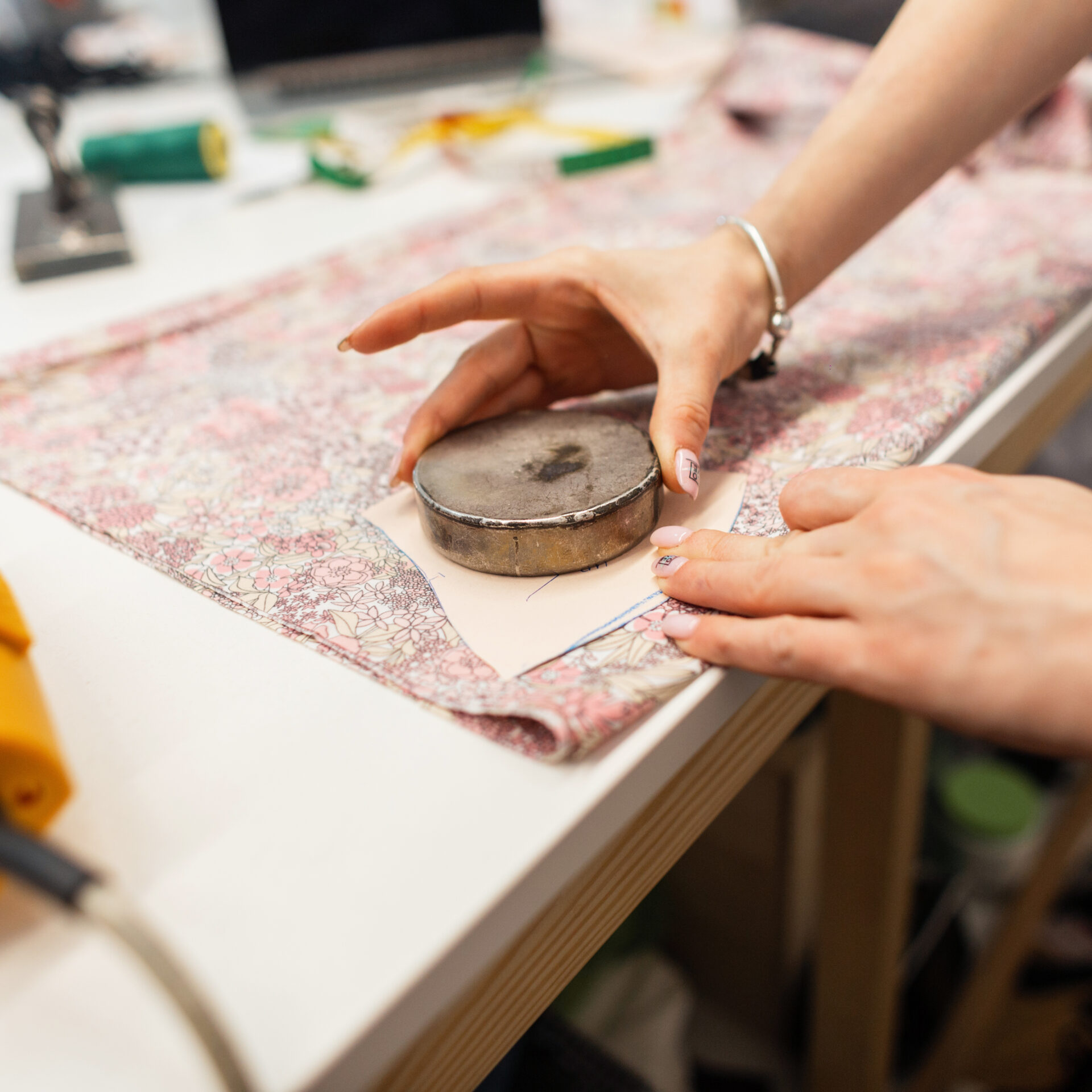 Tailor seamstress with fabric works in the studio. Fashion desig